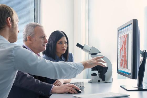 Laboratory researchers using BOND III system for sample analysis