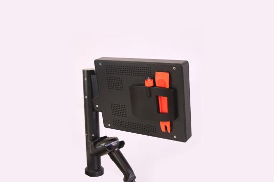 Cleaning tools are conveniently stored behind the monitor. That makes for easy access and ensures they won’t get lost.